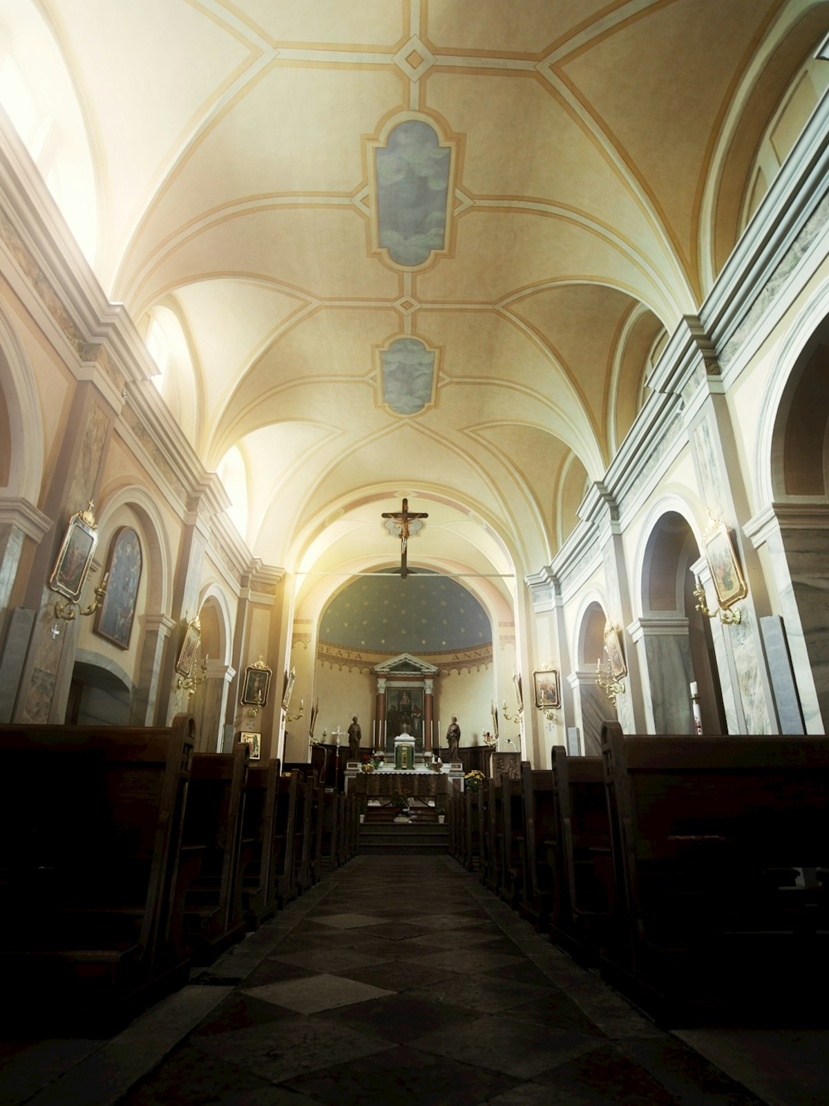 Interior of a Catholic church with pews and altar